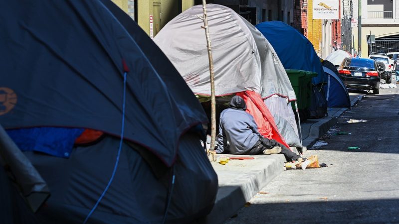 The Trump administration is looking to cut funding for a program that provides permanent housing to the homeless, a move that may leave those the program aims to help back on the streets, according to a report.
More than 170,000 people could be at risk of experiencing homelessness when more than half the funding for the Department of Housing and Urban Development’s (HUD) permanent housing program is cut, Politico reported on Monday, citing three HUD employees, internal HUD documents and a person with knowledge of the Continuum of Care (CoC) program.
The cut funds will be moved to transitional housing assistance with some work or service requirements, according to the internal documents and those with knowledge of the situation. The cuts could have a greater impact on rural areas that have less access to city and state funds to supplement federal dollars, the people told the outlet.
‘When the subsidy and the support that goes along with those subsidies is removed, it puts people at grave risk,’ said the person with inside knowledge of the CoC program. ‘And most of these folks without these supports will likely end up back in emergency shelters or back on our nation’s streets.’
HUD Secretary Scott Turner wrote in a  Fox News Digital opinion piecei earlier this month about a ‘paradigm shift’ in the department’s approach to homelessness and housing.
‘But our goal is to let HUD use real, proven effective strategies, and there is no evidence that giving free apartments to the homeless without preconditions or participation requirements – like job training or treatment – leads to good outcomes,’ Turner wrote. 
‘There is<i> </i>evidence, however, that countless lives have been lost to overdoses in HUD-funded housing because of this failed ideology,’ the secretary continued.
Turner wrote that HUD wants to continue to help support work that aims to aid those experiencing homelessness and battling addiction to recover and become self-sufficient.
Permanent housing funding for 2026 is currently $3.3 billion and could be cut in half to $1.1 billion through the Trump administration’s effort, according to Politico. 
This post appeared first on FOX NEWS